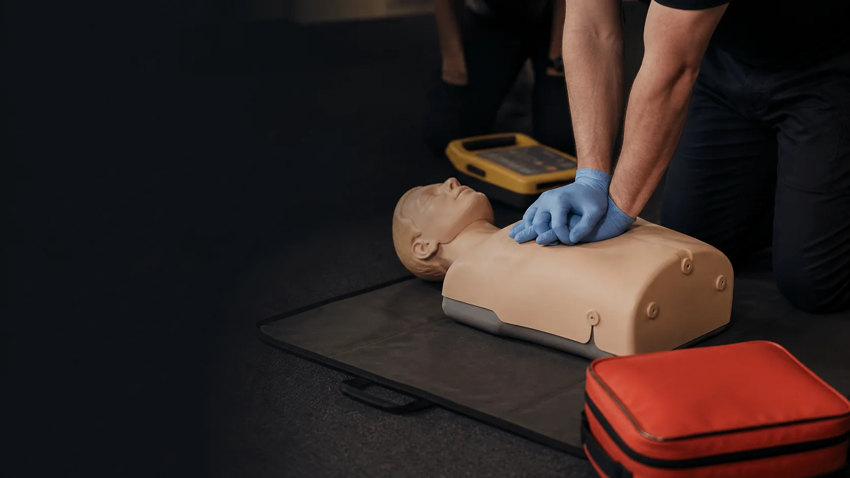 Hands-on CPR training with a manikin and AED trainer